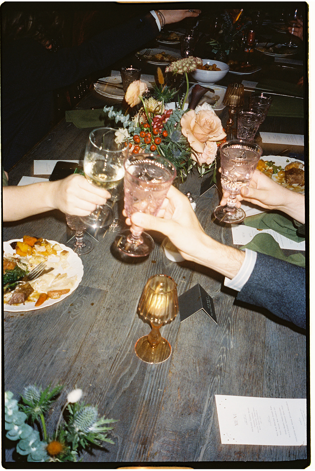 film photo of people giving cheers with vintage cups in brooklyn 