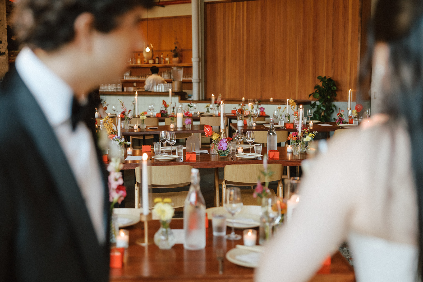candid photos of bride and groom looking at their wedding reception space